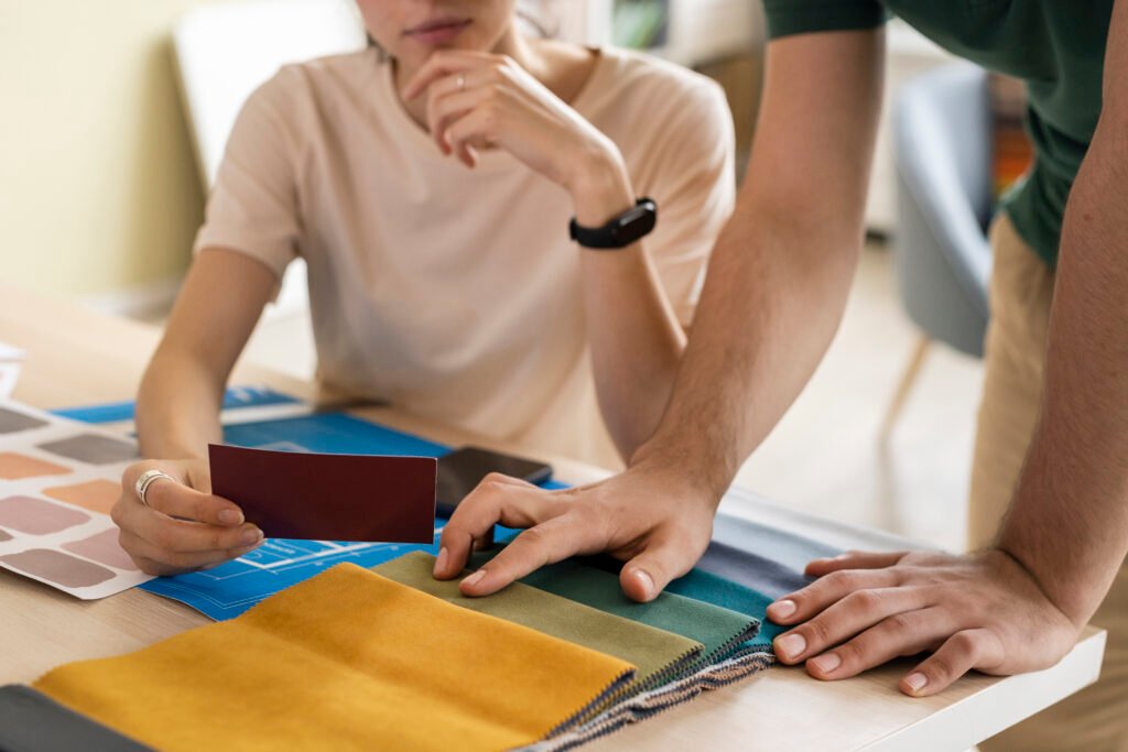 side view designers working together